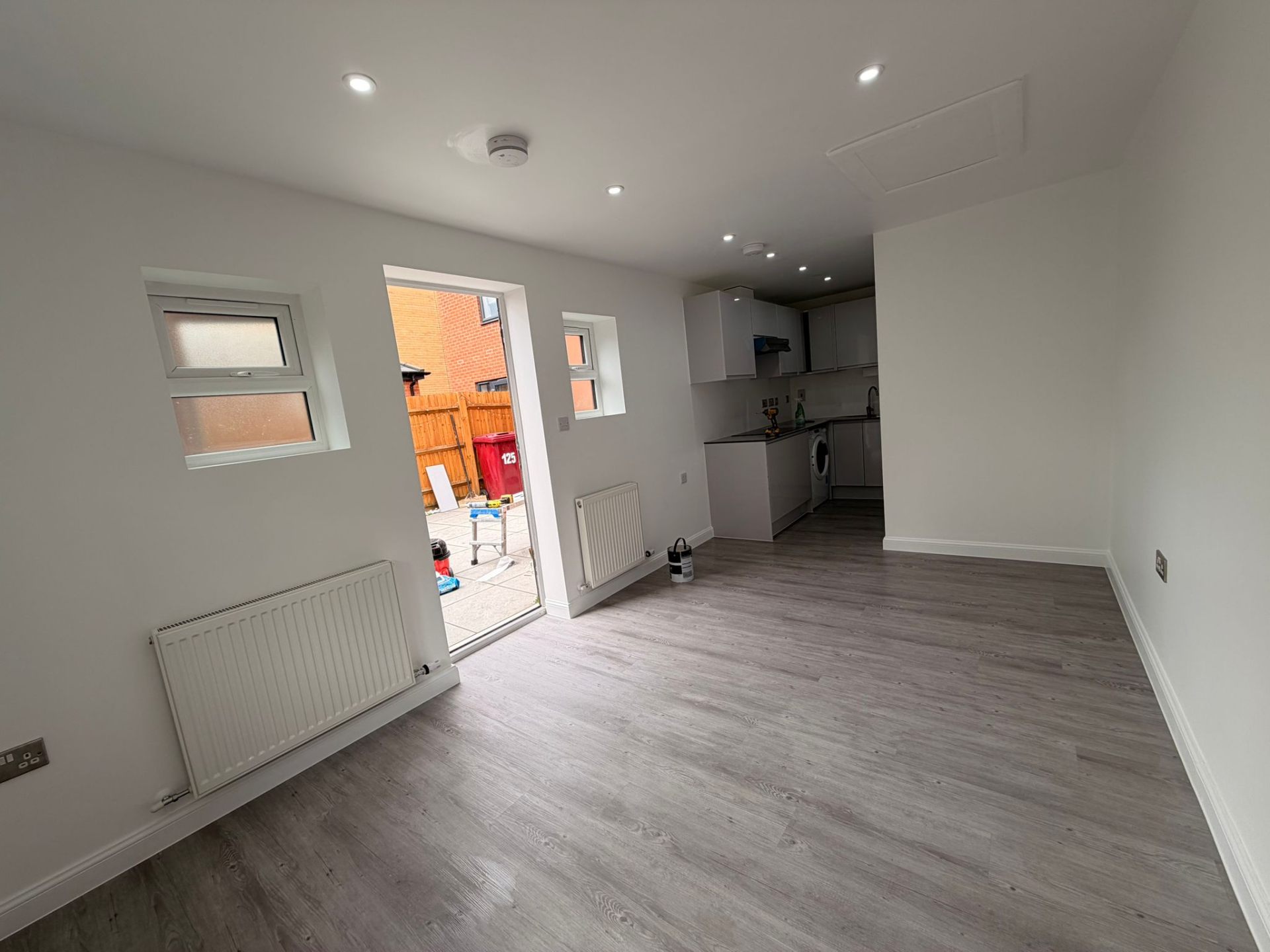 Bright open-plan kitchen and living area after renovation