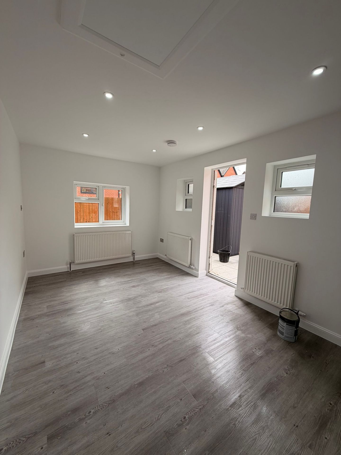 Finished living room with new flooring and decoration