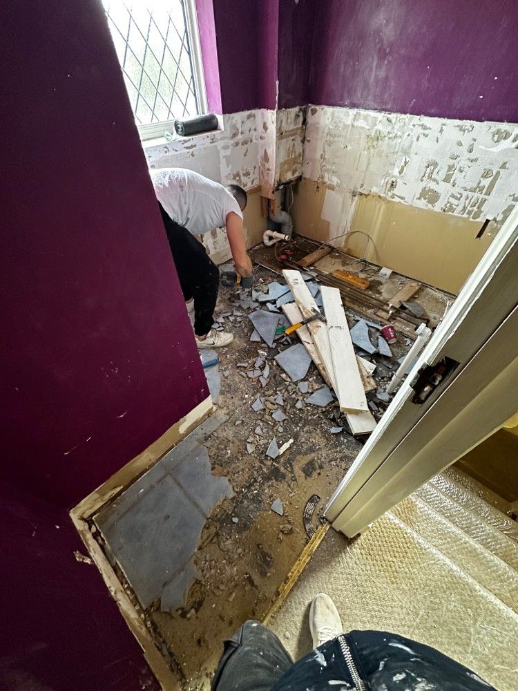 Bathroom stripped back to bare walls and floor before refit