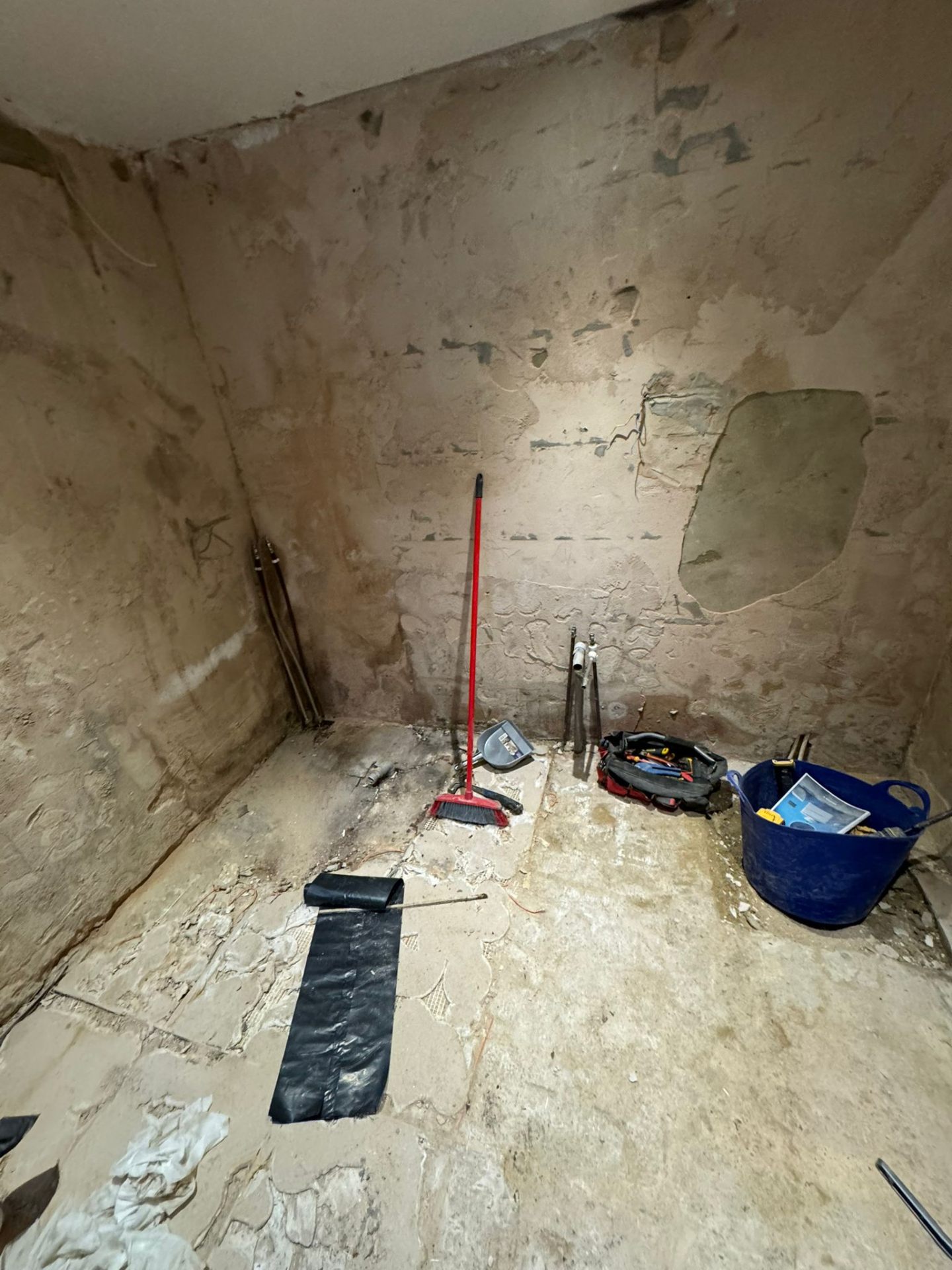 Bathroom stripped back to bare walls mid-construction